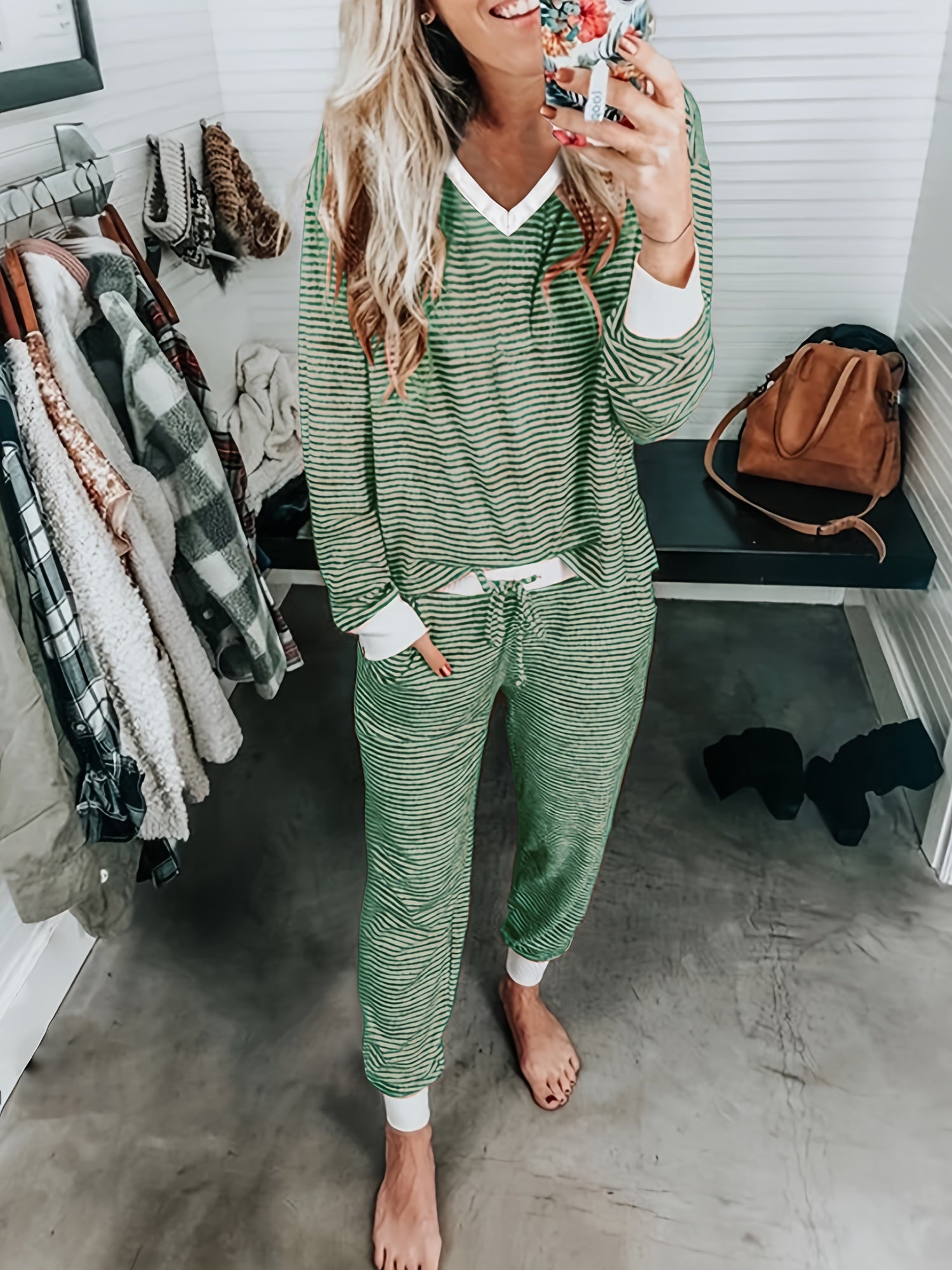 Striped V-neck knit loungewear set with long sleeves and pants.