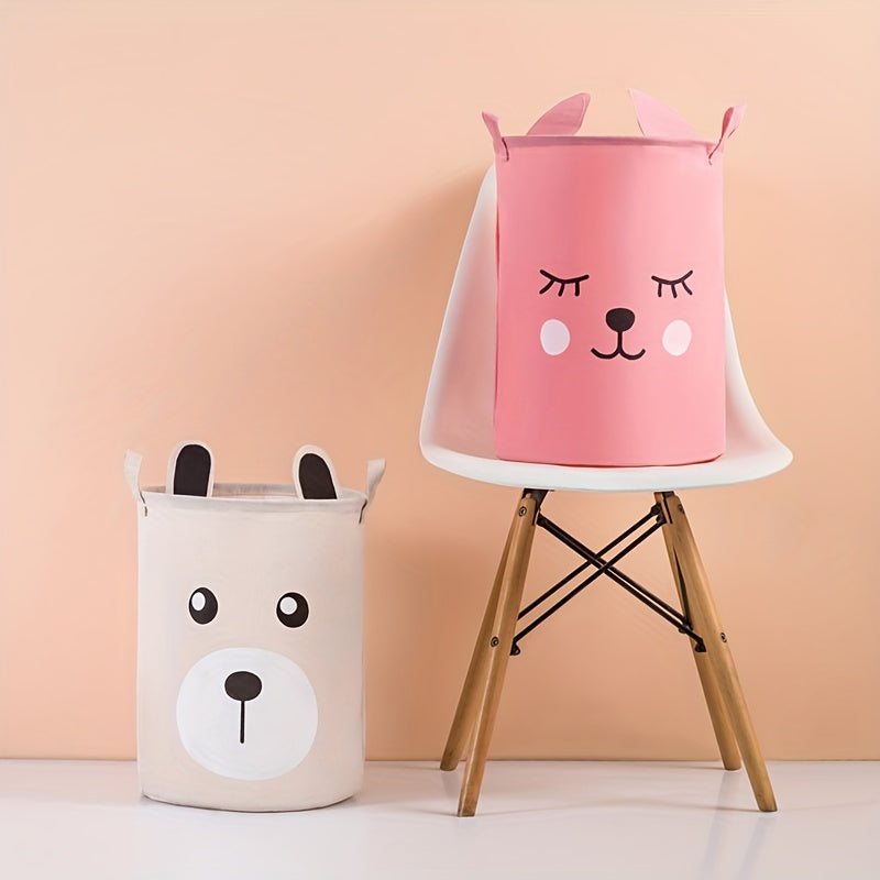 Waterproof fabric toy storage bin with cute cartoon design for kids' toys organization.