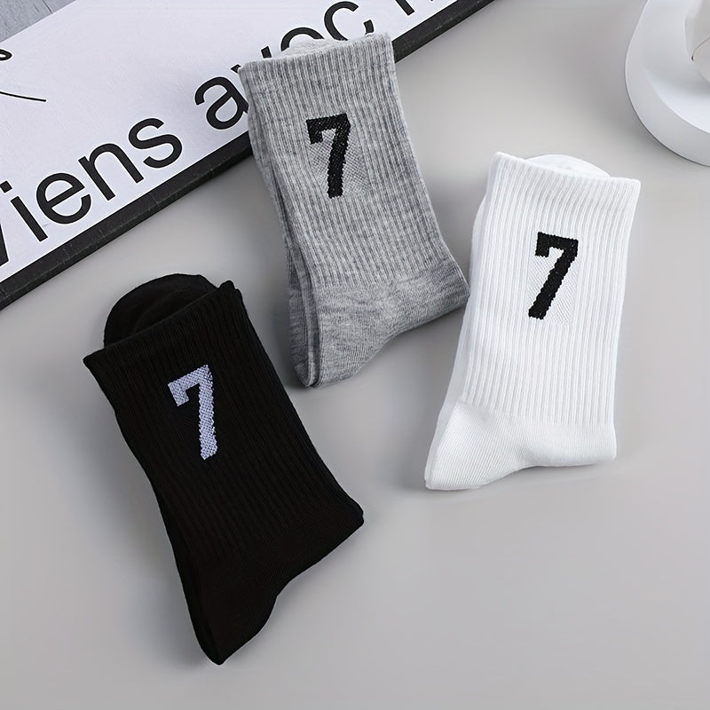 3 pairs of men's mid-calf socks with 17.78cm trendy design in black, white, and gray colors. Made of soft polyester/spandex blend, breathable and sweat-absorbent. Casual athletic wear