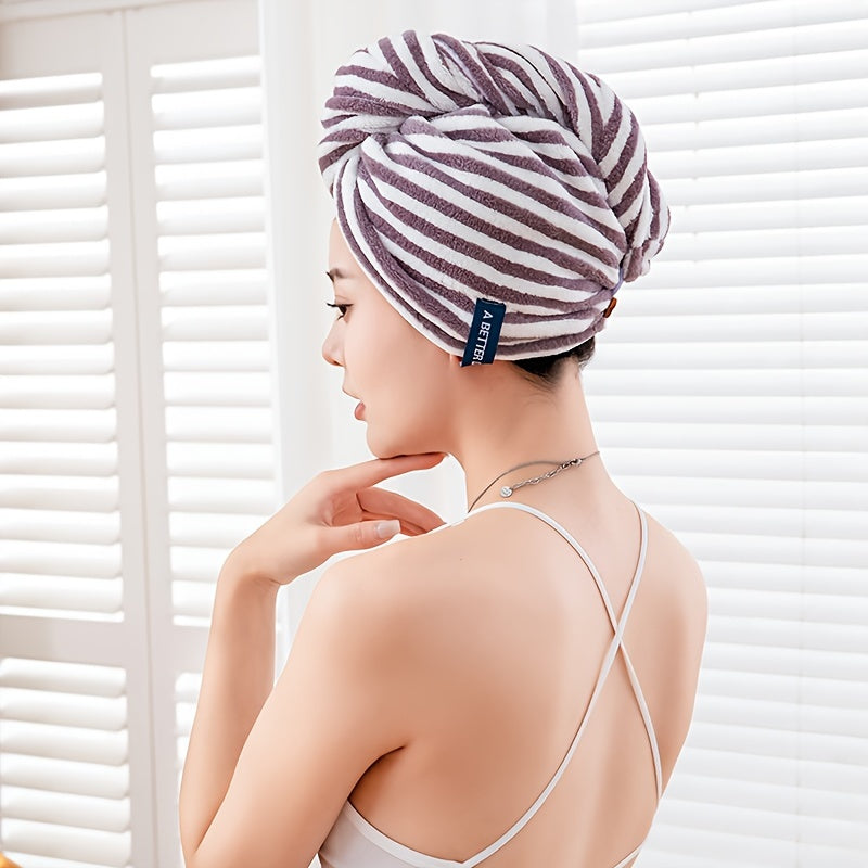 Modern blue and white striped hair towel wrap with button closure. Ultra-soft, absorbent, and low-shedding. Perfect for quick drying in a space-themed bathroom.