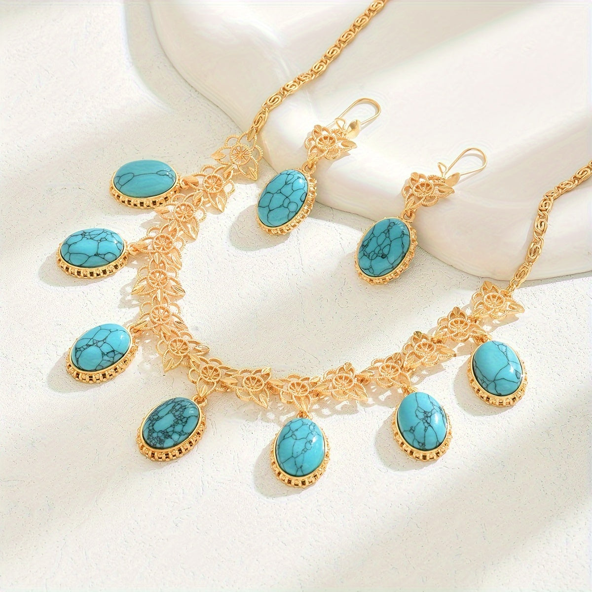 Luxurious and versatile evening dress jewelry set in a three-piece Middle Eastern New Style. Featuring multi-pendant stone hollow earrings and necklace, this exaggerated fashion set exudes high-end luxury. The retro bohemian ethnic style adds a unique