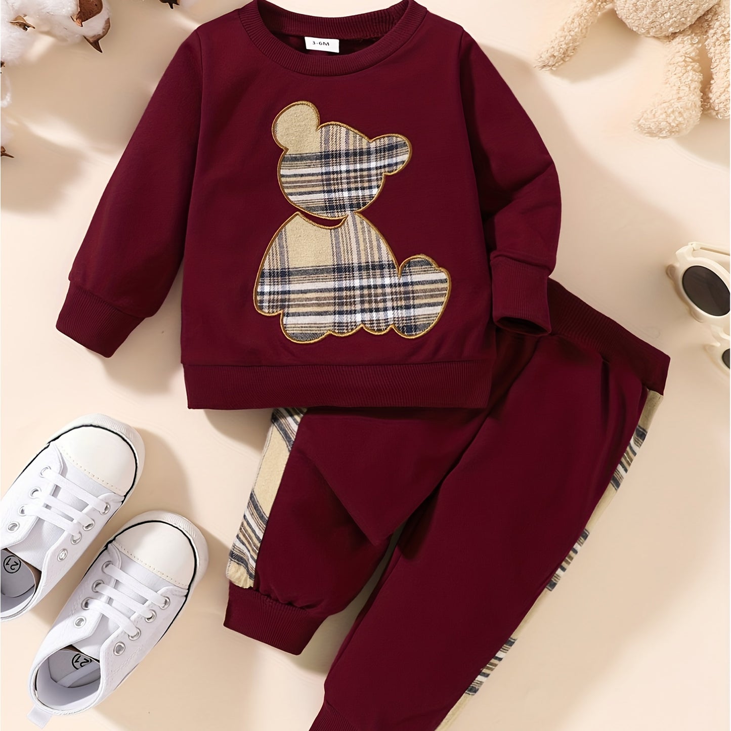 Toddler boy's outdoor fall/winter outfit with long sleeve sweatshirt and casual pants.