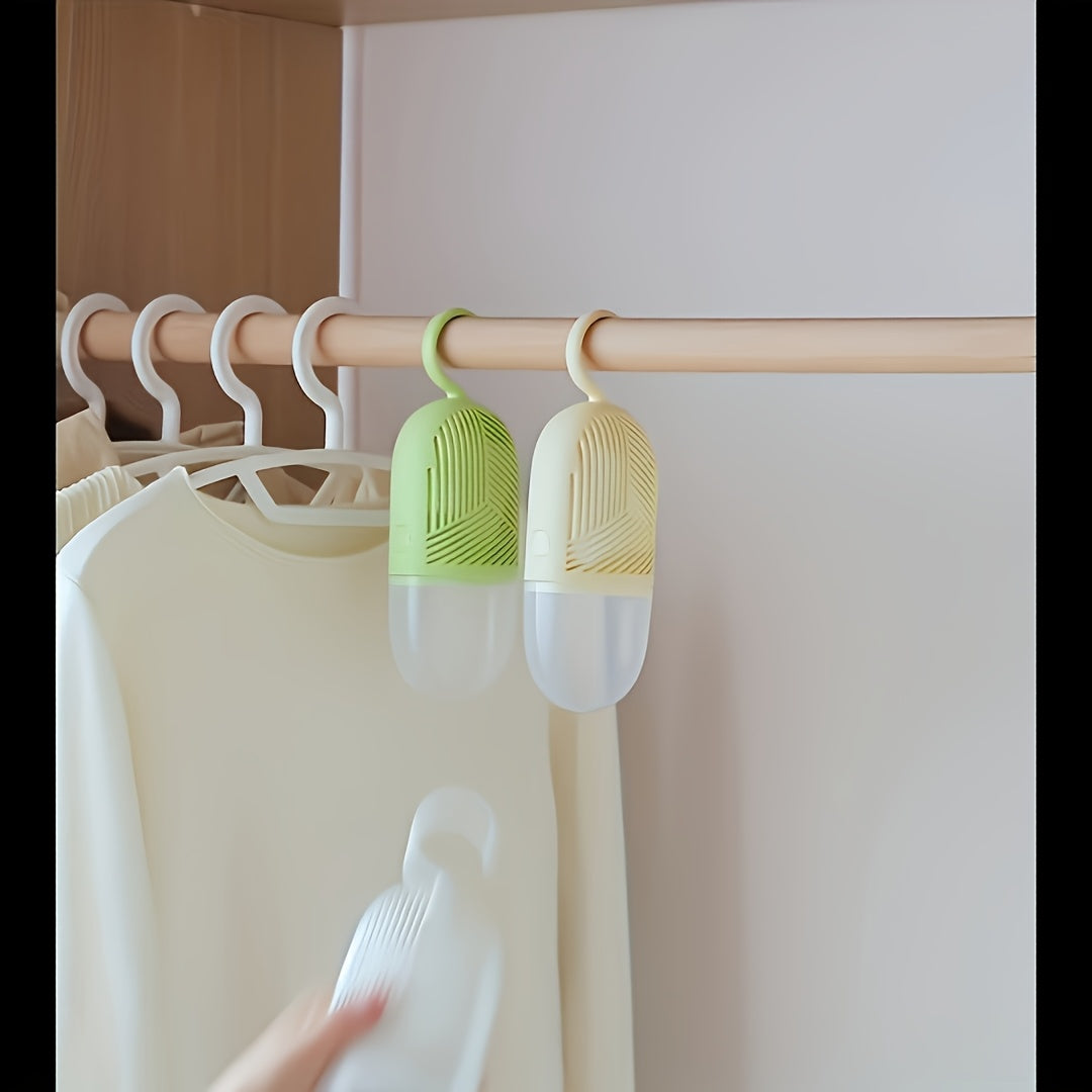 Small plastic manual dehumidifier with high water absorption, ideal for wardrobes and shoe cabinets. Energy-free operation for long-term moisture and mildew prevention.