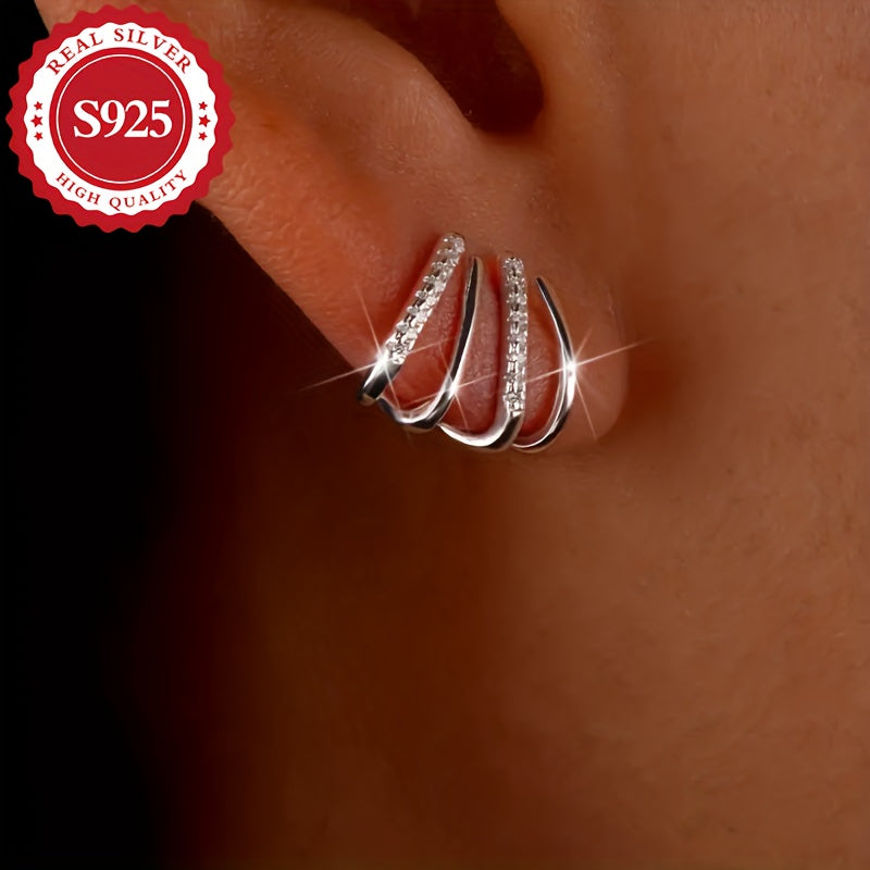 A set of exquisite S925 Sterling Silver earrings with claw-set Zirconia studs - dazzling, hypoallergenic, suitable for all occasions, great as a gift, unique design, perfect for the holiday season.