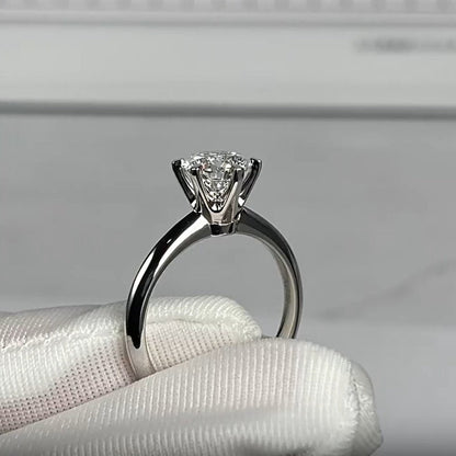 A stunning 925 silver ring with a 0.5 carat Moissanite stone in a six-prong setting. Perfect for both everyday wear and special occasions like engagements and weddings.