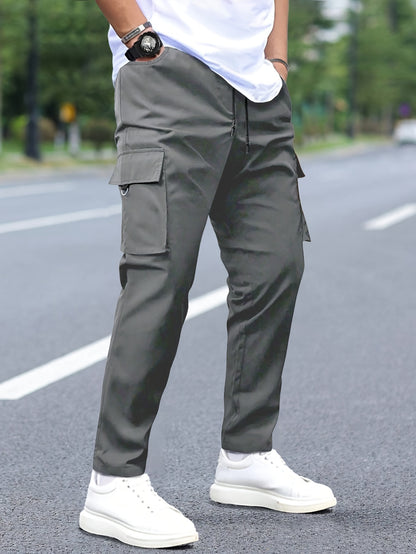 Men's cargo pants with multiple pockets and drawstring for outdoor activities.