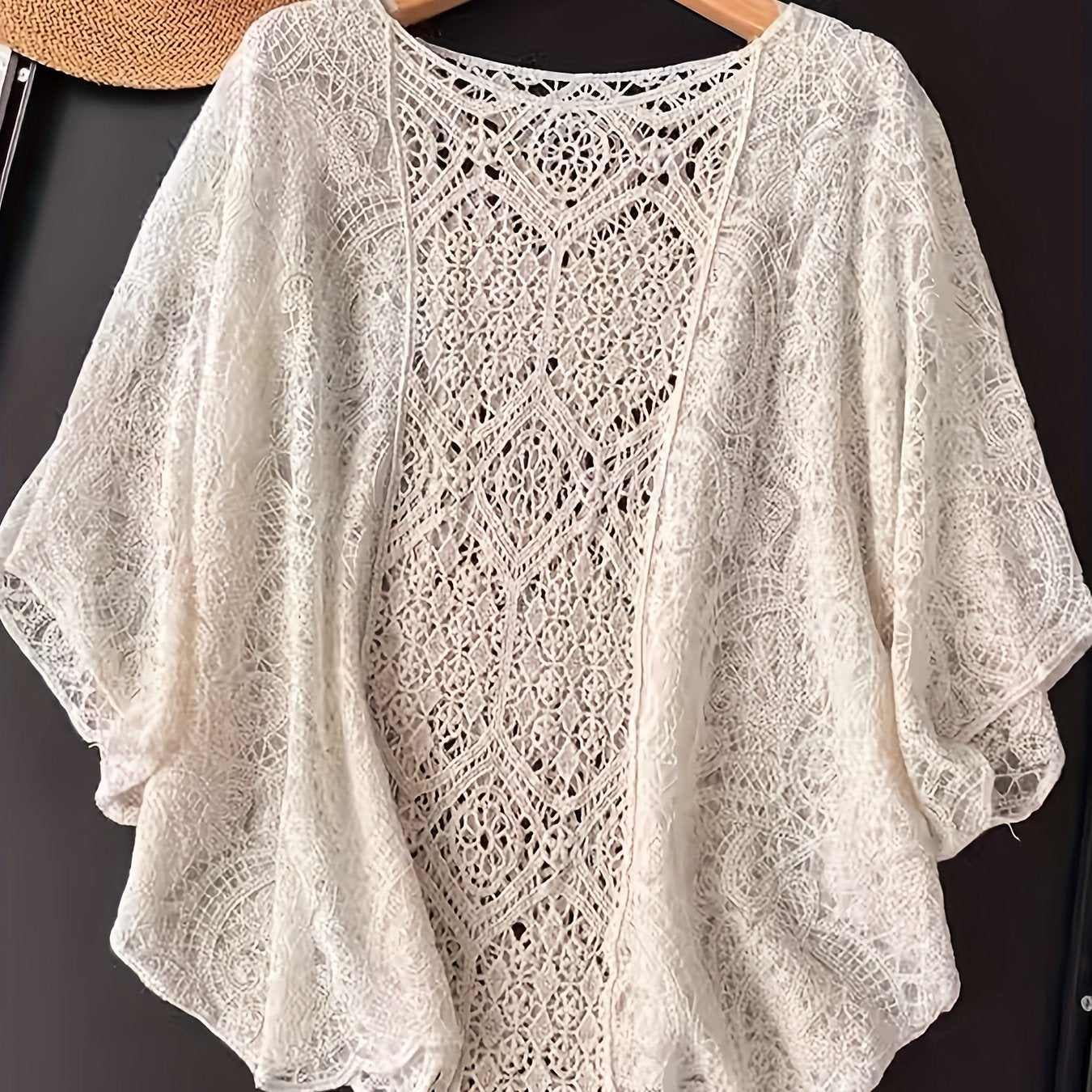 Bohemian embroidered round neck sun-proof smock with five sleeves.