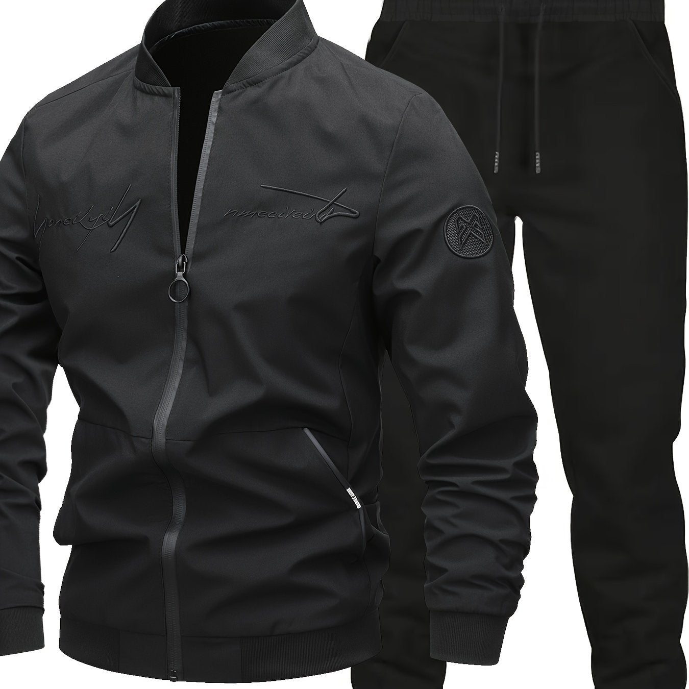 Men's Classic Bomber Jacket & Jogging Pants Set in sleek black with letter embroidery. Made of durable polyester with elastic cuffs and waistband. Ideal for outdoor activities and casual