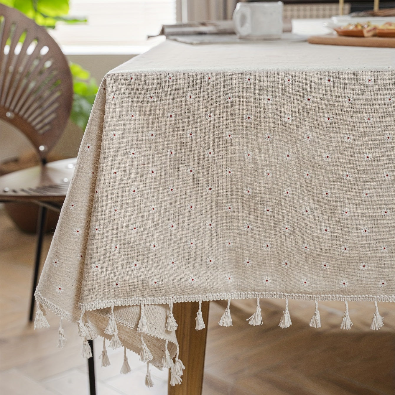 White chrysanthemum and beige linen print farmhouse floral tablecloth with tassels, ideal for kitchen and dining decor. Ready for Thanksgiving, made of polyester, rectangular shape.