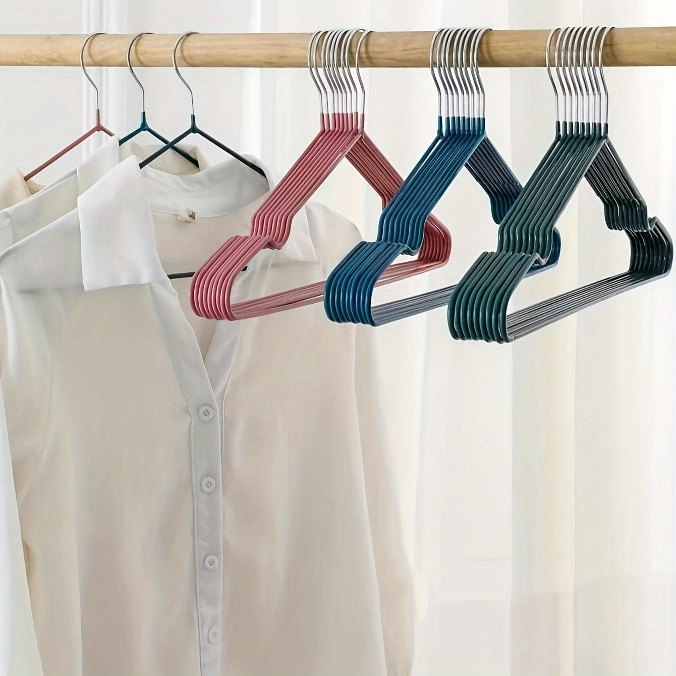 Essential for any home wardrobe, these durable non-slip metal hangers come in a convenient 10-pack. Featuring shoulder grooves to keep clothing in place, these space-saving hangers are perfect for hanging tops and dresses.