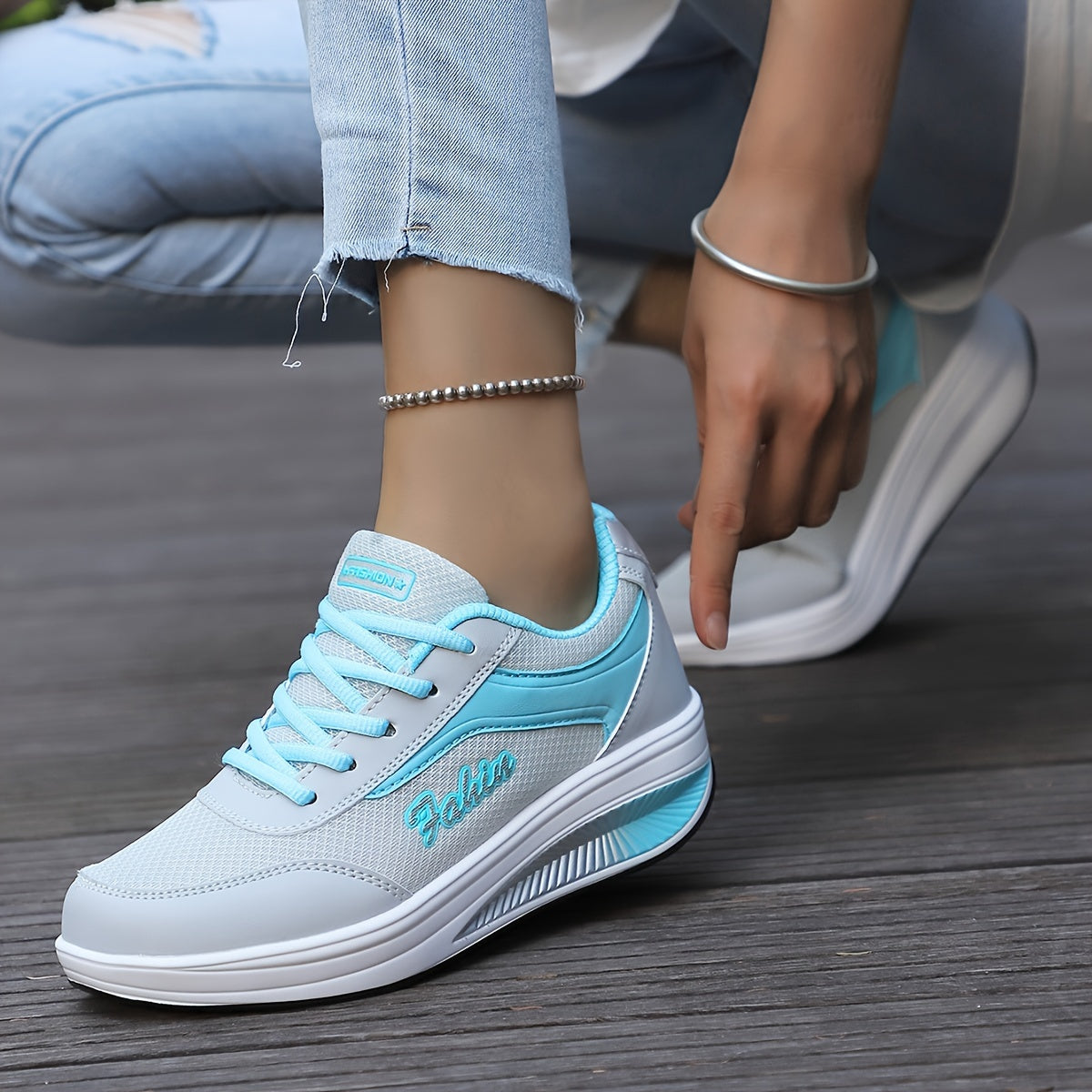 Women's platform sneakers with breathable mesh, lace-up design, and comfortable fit in plus size