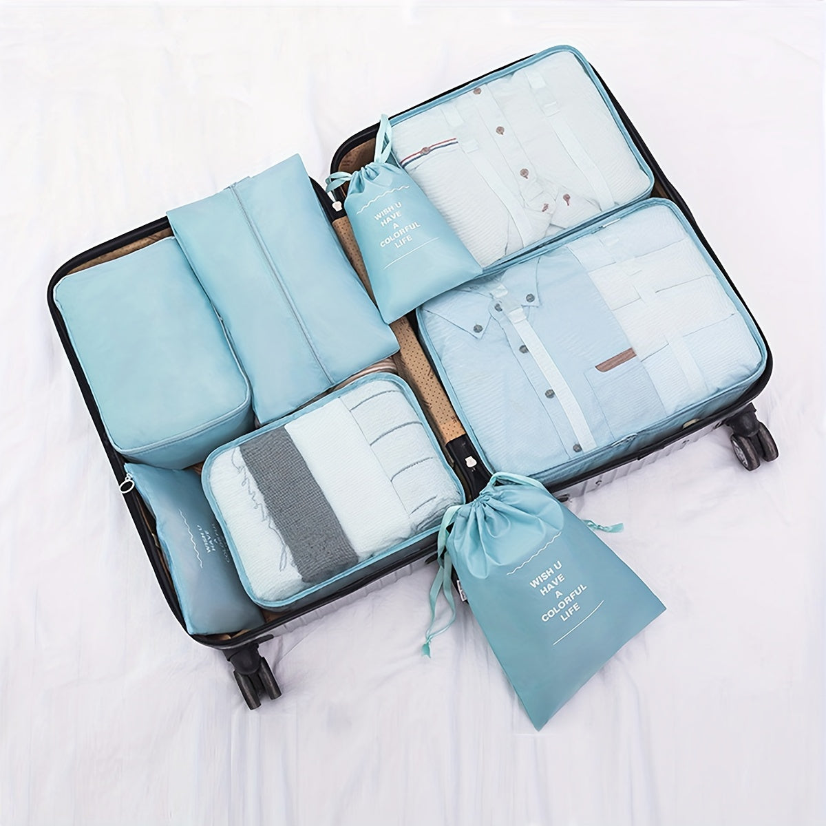 7 lightweight packing cubes for suitcases, ideal for organizing travel items and clothing for men and women.