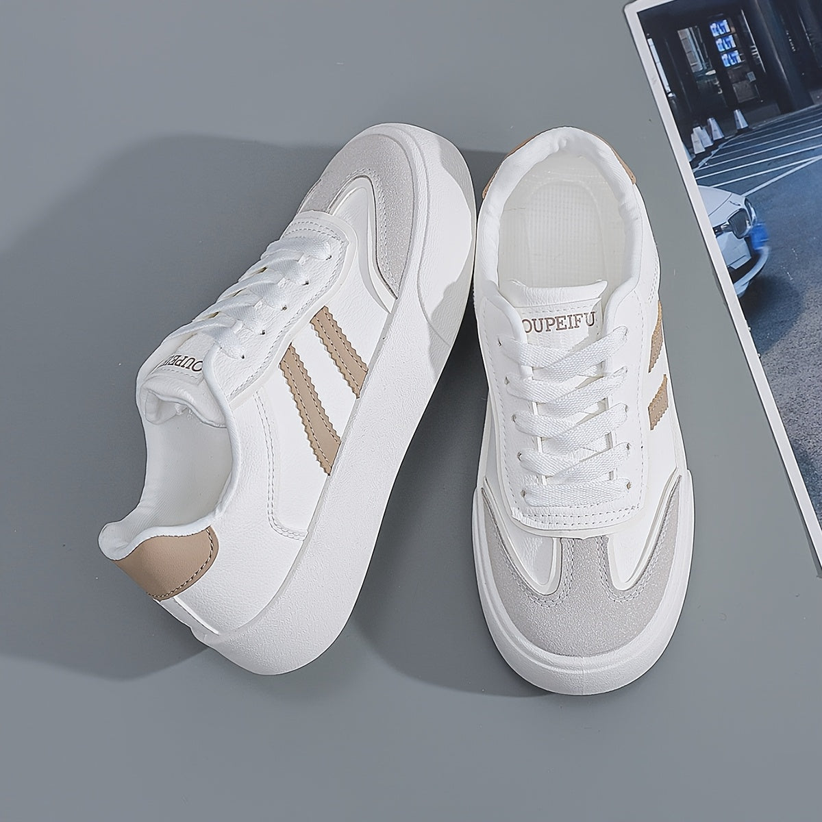 Women's lightweight white sneakers with beige accents are comfortable all-season footwear with a trendy classic design.