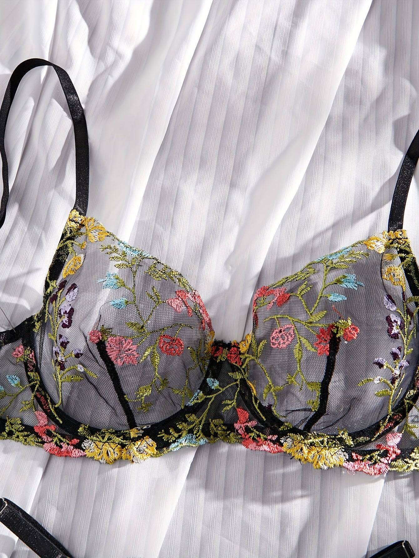 Floral embroidery underwear set with semi-transparent gathered bra and thong panties for a sexy and fresh look.