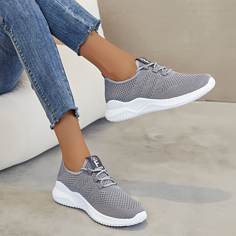 Women's comfortable low top running shoes with breathable knit fabric and thick soles for outdoor activities.