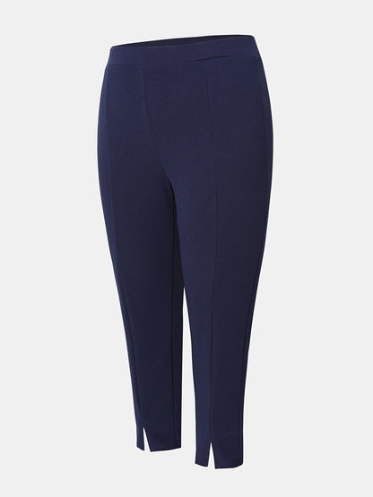 Stylish plus size high waist slim-fit pants with side slits in solid color, machine washable.