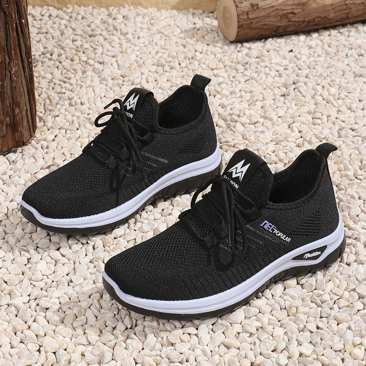 Black knit mesh sneakers with lace-up closure, dual-layer sole, and easy slip-on design for daily commute and outdoor activities. Sleek, breathable and perfect for daily wear.