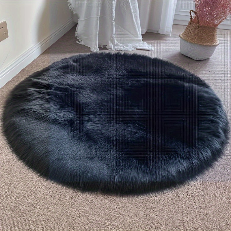 Round luxury area rug made from soft faux fur material with high pile and knit weave, machine washable, lightweight and fluffy. Crafted from a blend of polyester and acrylic in a solid color design. Perfect for adding a cozy touch to bedroom, living