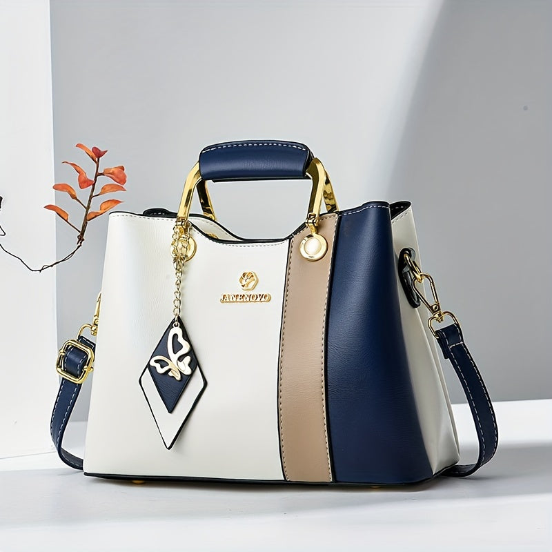 Chic navy blue, white, and beige colorblock tote with golden hardware, adjustable strap, magnetic closure, spacious interior, and lightweight design - perfect for daily use.