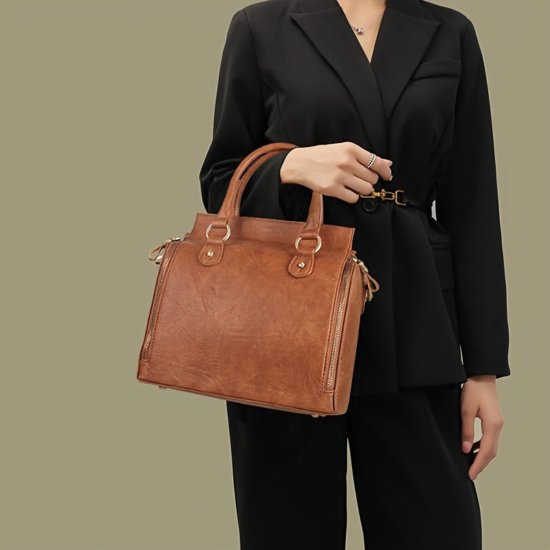 Fashionable women's tote bag with adjustable shoulder strap, multiple compartments, and large capacity, including a makeup bag.