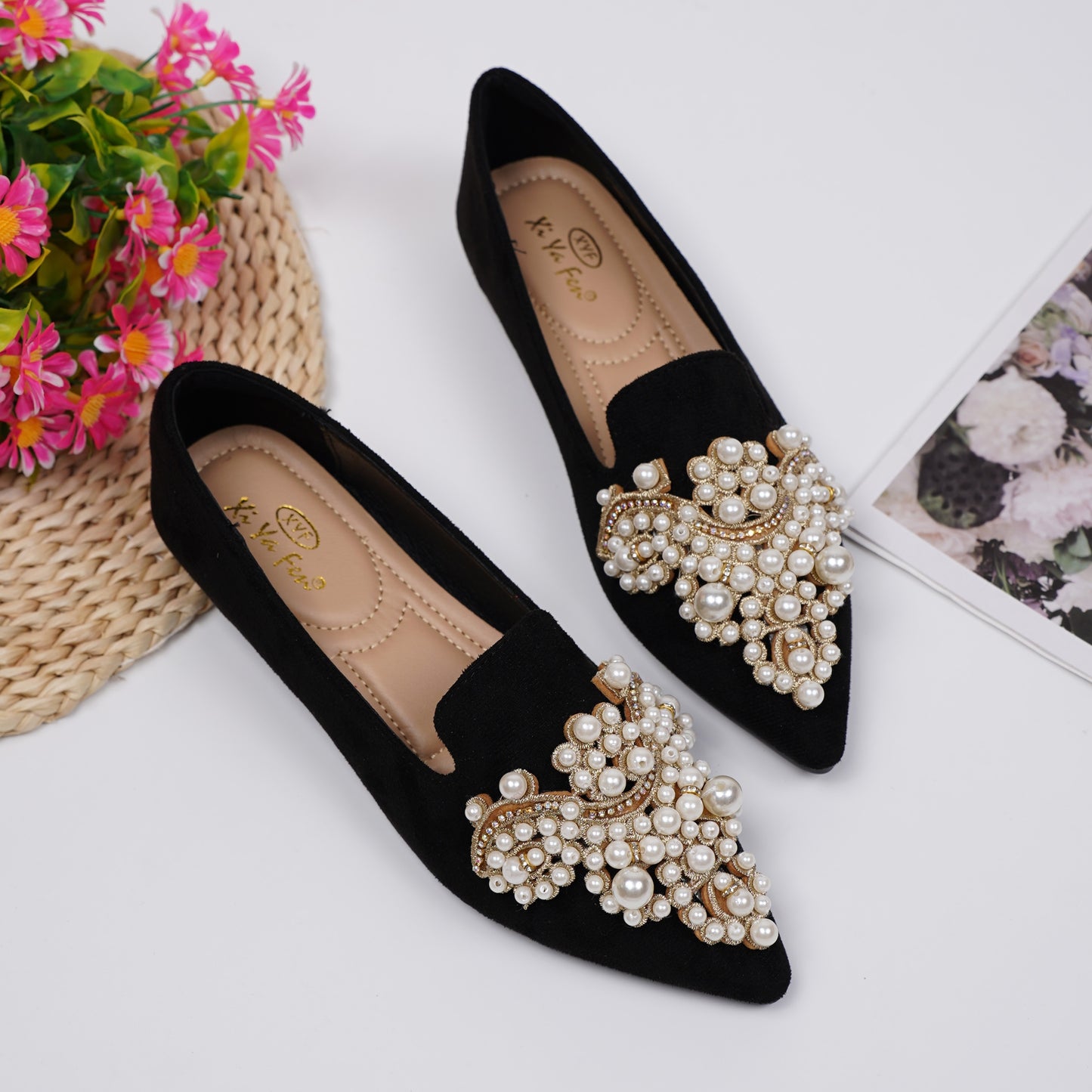 Women's elegant flat shoes with faux pearl decoration, point toe design, and lightweight comfort.