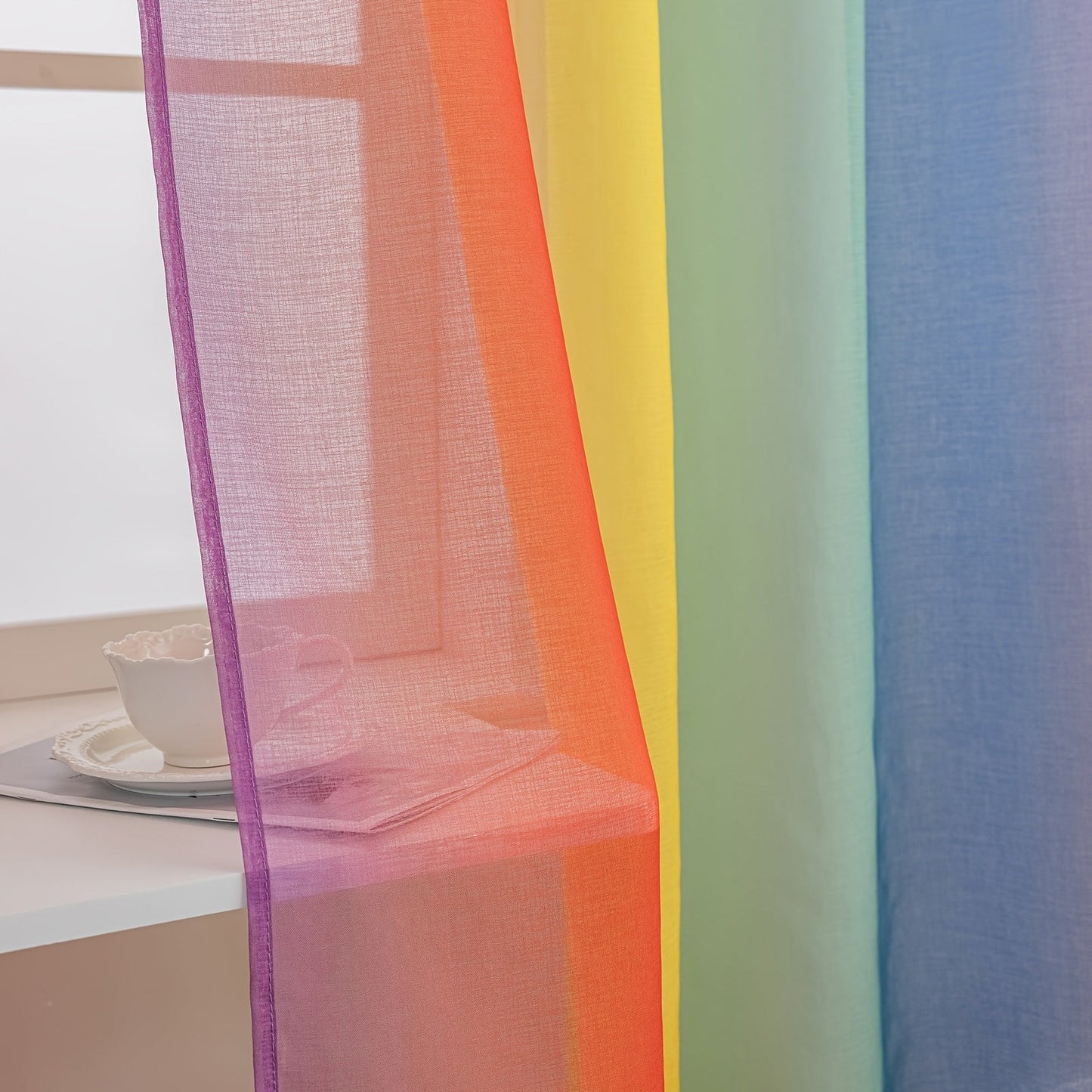 Set of 2 Modern Rainbow Stripe Sheer Curtains made of 100% Polyester, with Rod Pocket design for easy hanging in Living Room, Bedroom, or Office. These Decorative Unlined Panels can be Hand Washed and are suitable for all seasons. Enjoy the Transparent