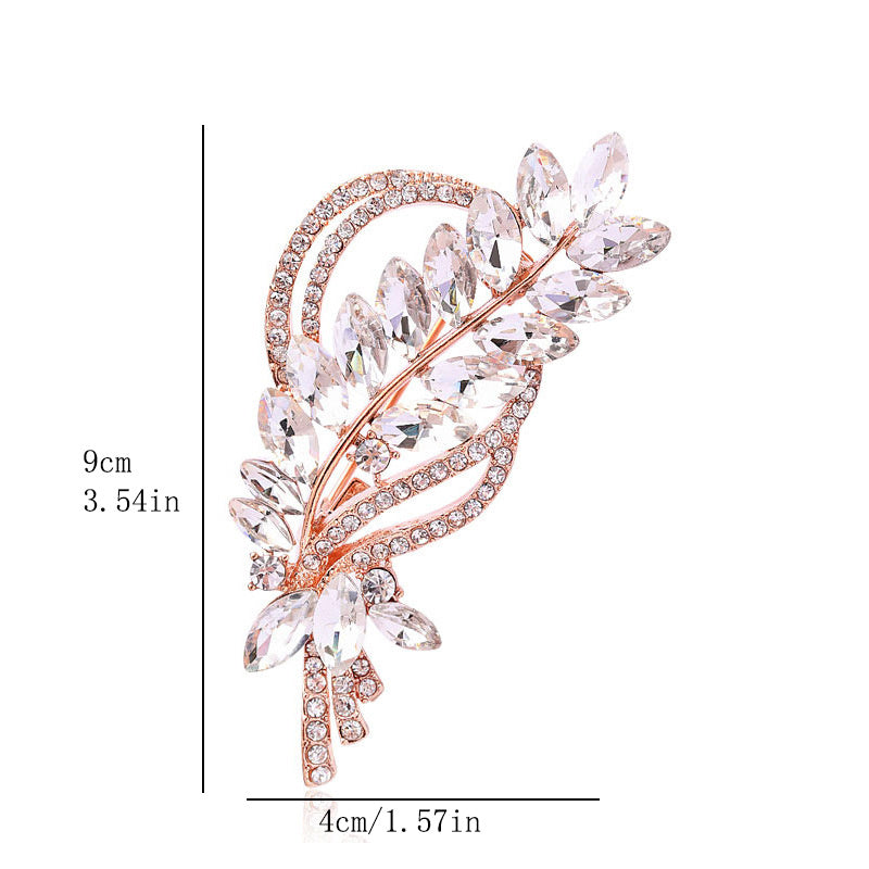 Add a touch of sophistication with our Rhinestone Leaf Brooch Pin - Exquisite design for your dresses and sweaters