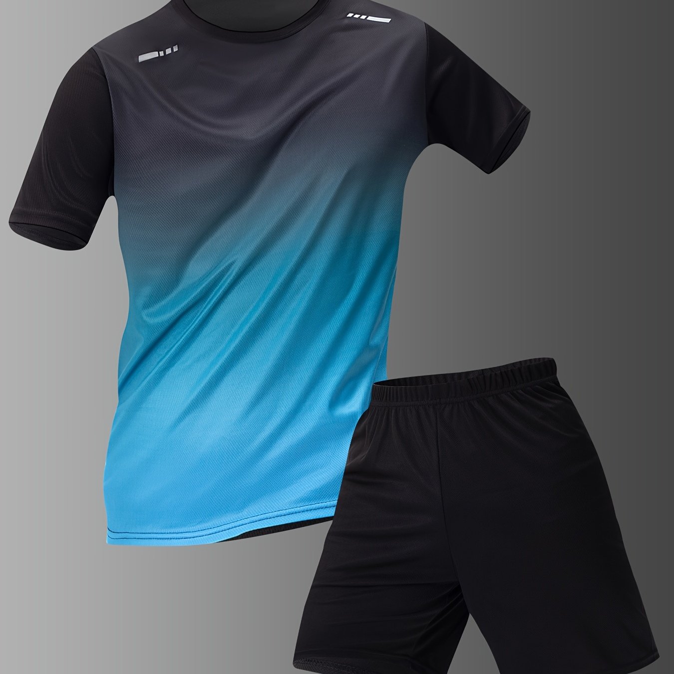 Men's casual sportswear set with gradient short sleeve t-shirt and solid elastic waist shorts for summer sports.