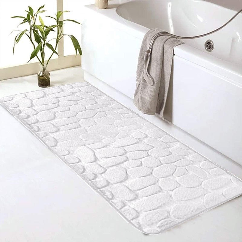 SoftTouch Cobblestone Pattern Memory Foam Bath Mat is machine washable and non-slip, making it a perfect addition to any bathroom. The absorbent polyester material resists stains, making it ideal for use in the bathtub or kitchen. This home decor runner