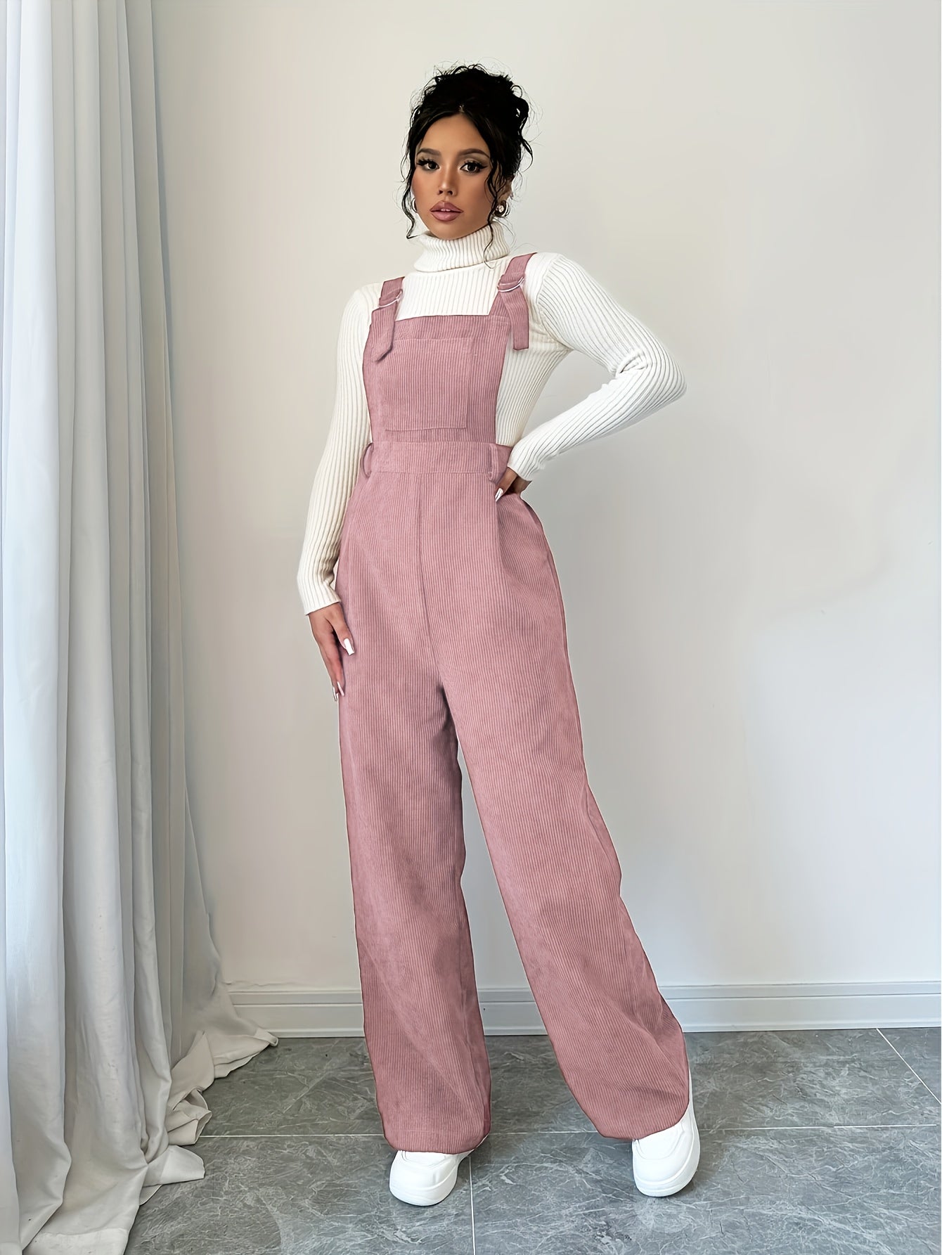 Spandex polyester jumpsuit for women with wide straps and button details, perfect for fall and winter.