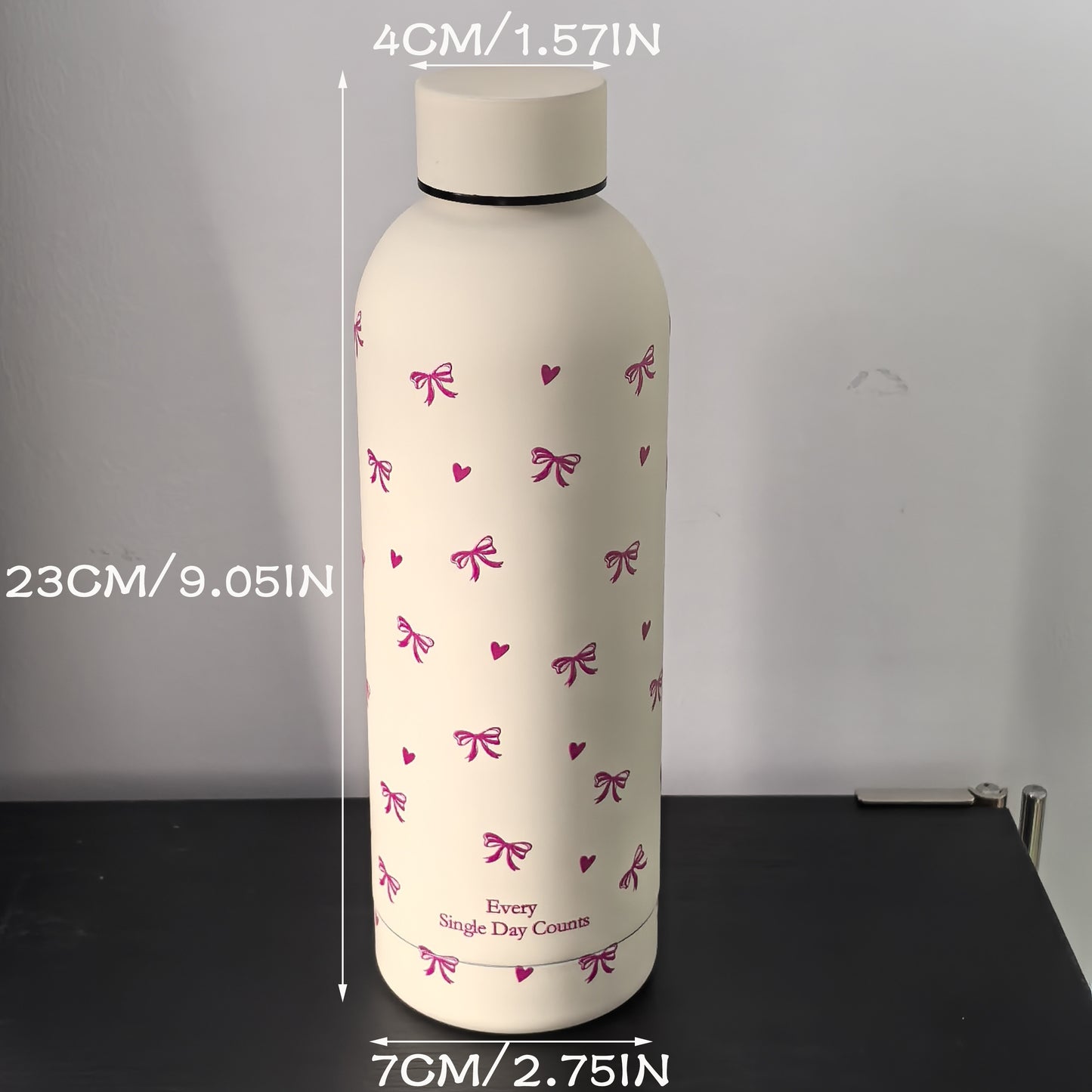 Insulated stainless steel water bottle with bowknot and heart design, perfect for travel, gym, outdoor, and car use. BPA-free and hand wash only.