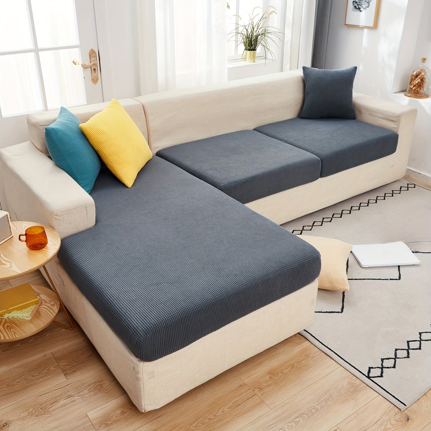 Durable sofa cover protects furniture from spills and stains.