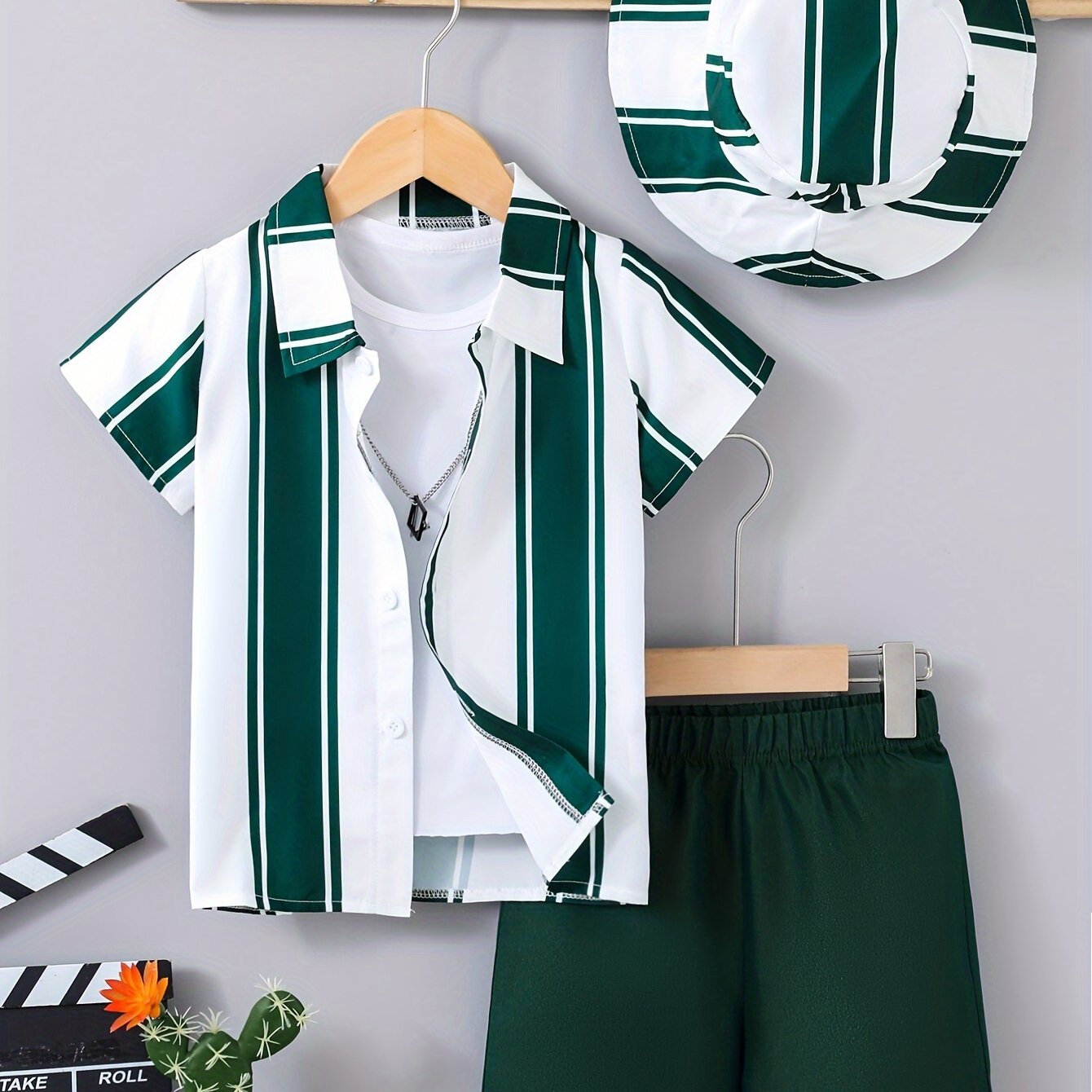 3-piece casual summer outfit for boys includes striped shirt, pocket shorts, and hat.