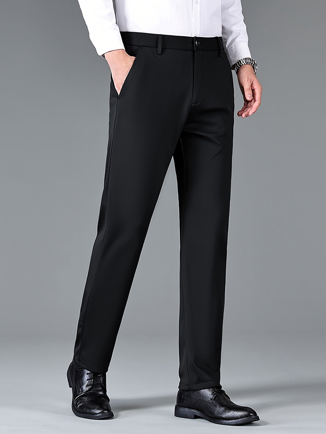 Men's casual long pants from the Spring/Fall Collection feature a mid-waist regular fit with slight stretch. Made of 94.6% polyester and 5.4% spandex, these pants have a button fly and