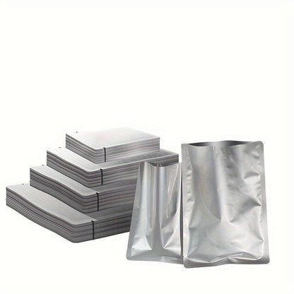 A pack of 100 small pure aluminum vacuum sealer bags in sizes 6x8cm, 7x10cm, and 8x12cm. These aluminum foil food storage pouches are made of PET material and do not require electricity.