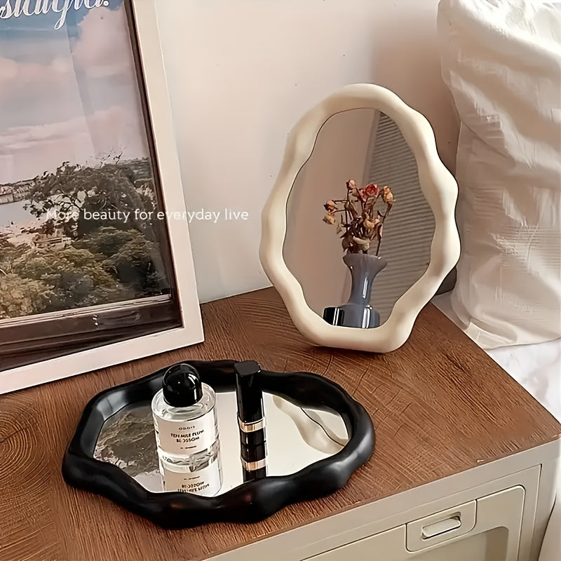 One stylish irregular desktop makeup mirror with adjustable plastic frame and glass surface for bathroom, office, and bedroom decor.