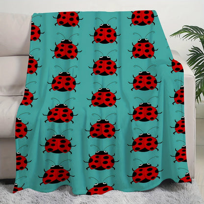 Stay warm and stylish with our cozy ladybug print flannel throw blanket. This soft and versatile blanket is perfect for your couch, bed, office, or travel. It is machine washable and makes a great gift idea for any season.