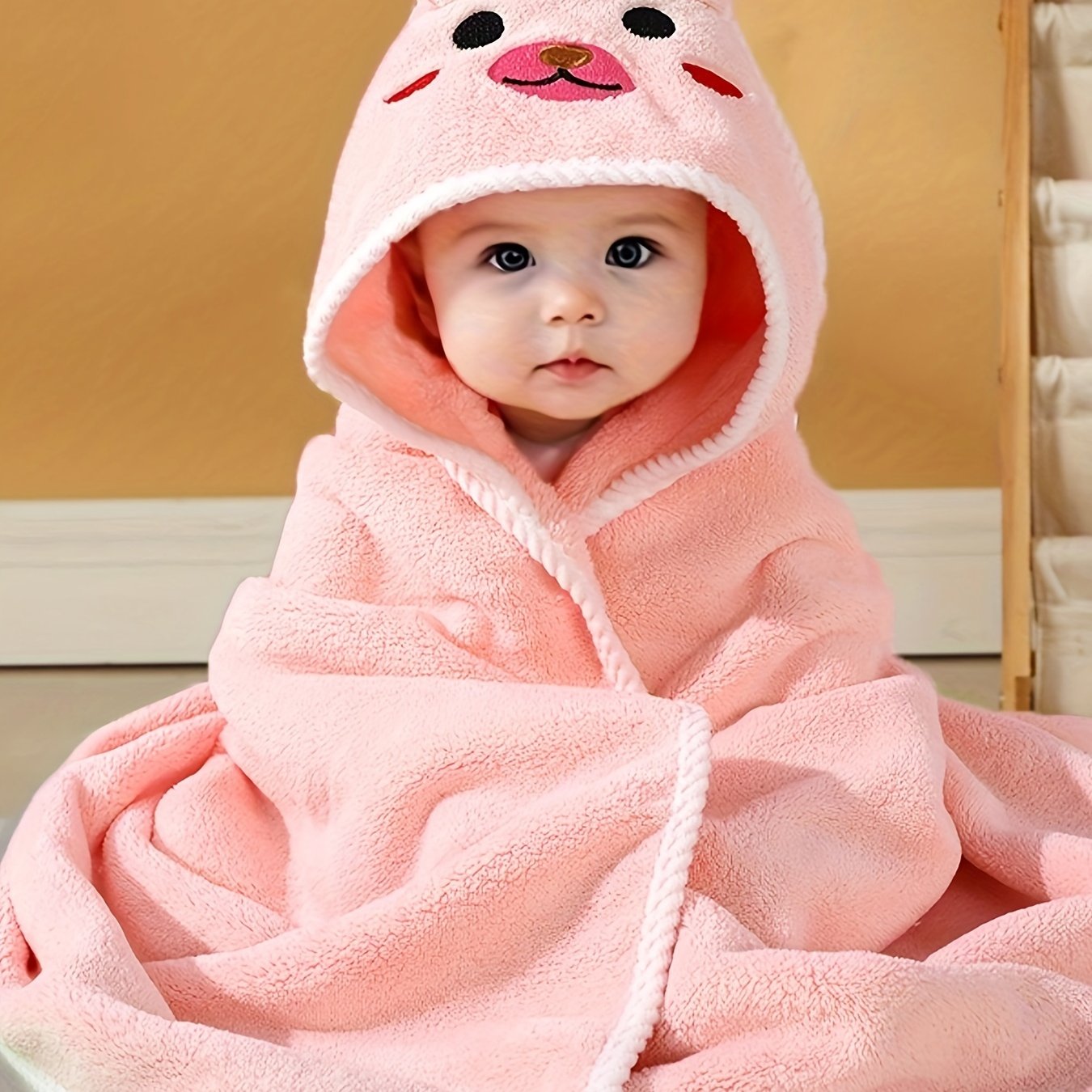 Multi-functional and highly absorbent hooded bathrobe with animal pattern for babies, ideal for swimming, beach, or bathing.