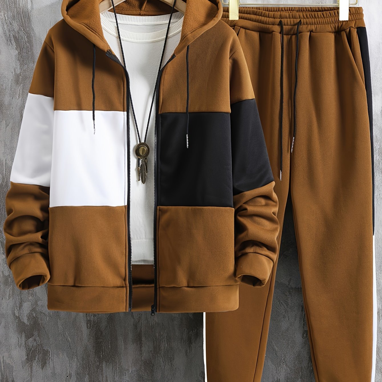 Men's 2-piece color block athletic tracksuit with long sleeve zip up hoodie, drawstring, and jogging pants for gym workouts and running.