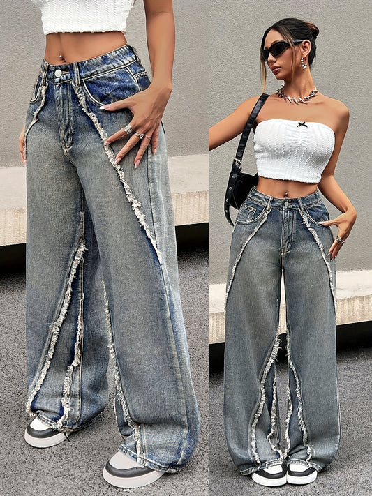 Women's loose fit wide leg jeans with a raw hem and washed blue finish.