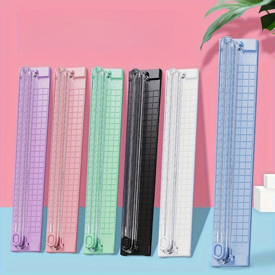 Portable paper cutter trimmer for A3/A4 paper, ideal for school, home, and office use. Made of durable plastic material.