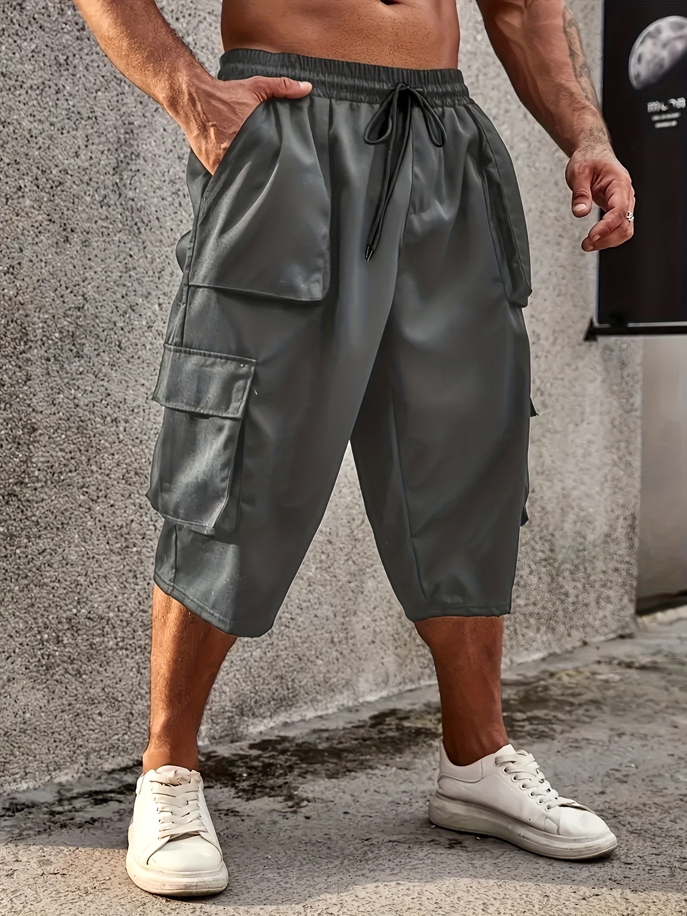 Men's plus size cargo pants with drawstring and pockets, loose fit, and comfortable breathability.