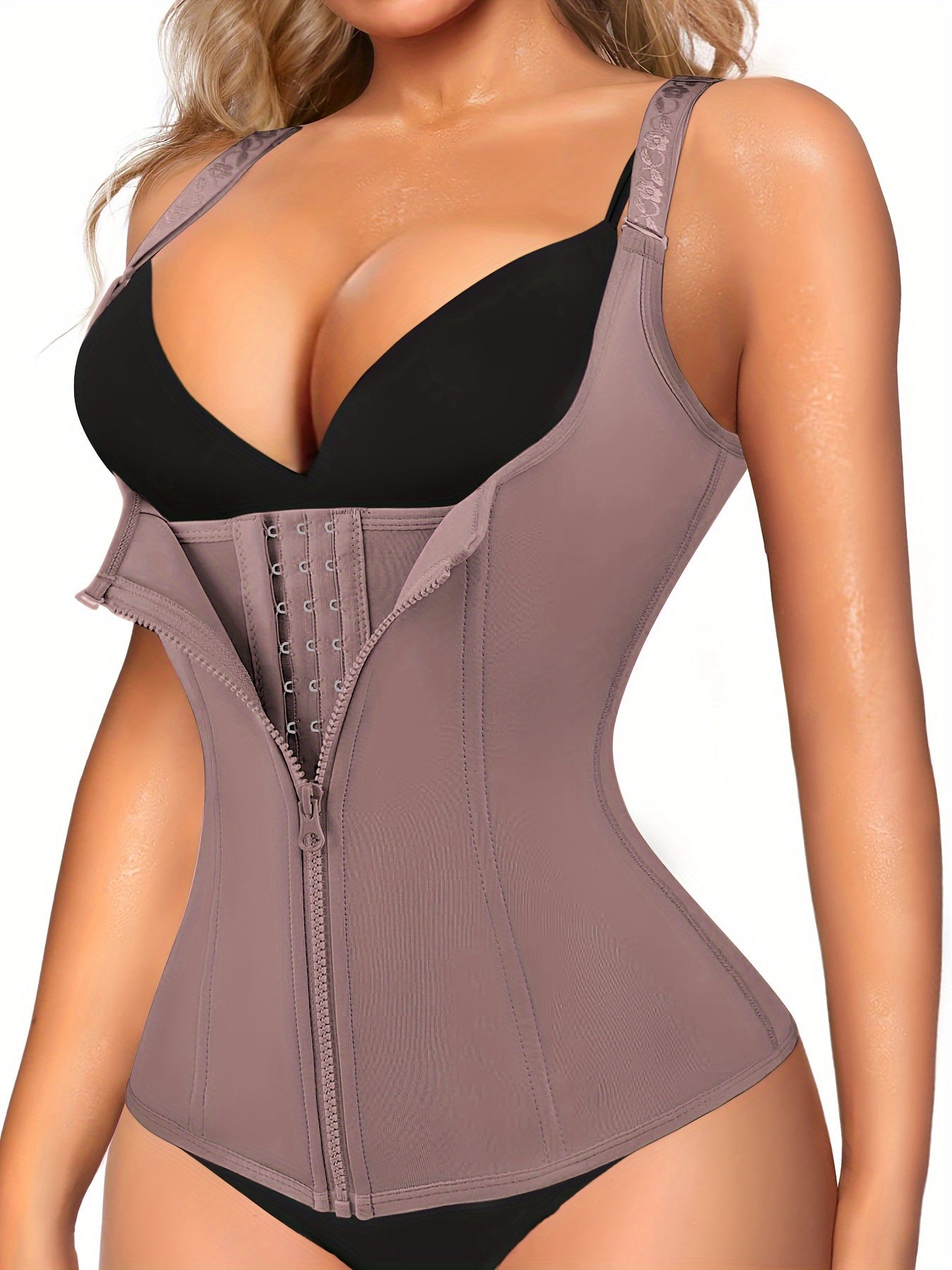 Enhance your curves and define your waistline with Junlan Women's Black Zipper Shaping Cami Top. This waist trainer features tummy control and open bust design for a slimming effect. Made