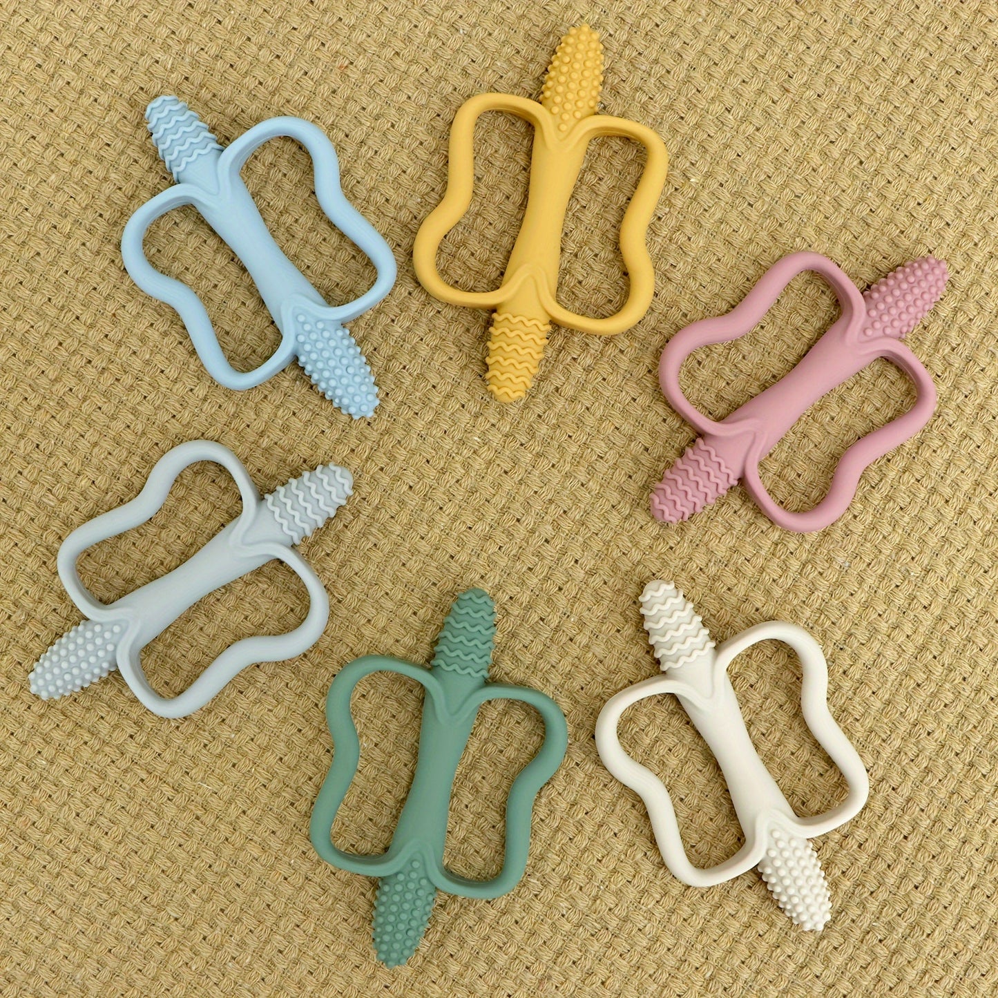 Soft silicone butterfly-shaped baby teether designed for easy gripping and soothing teething relief. Suitable for ages 0-3 years, available in multiple colors, and easy to clean. Perfect as an ideal baby gift.