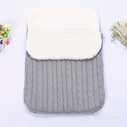 Machine washable baby foot cover with knitted microfiber filling for warmth and comfort.