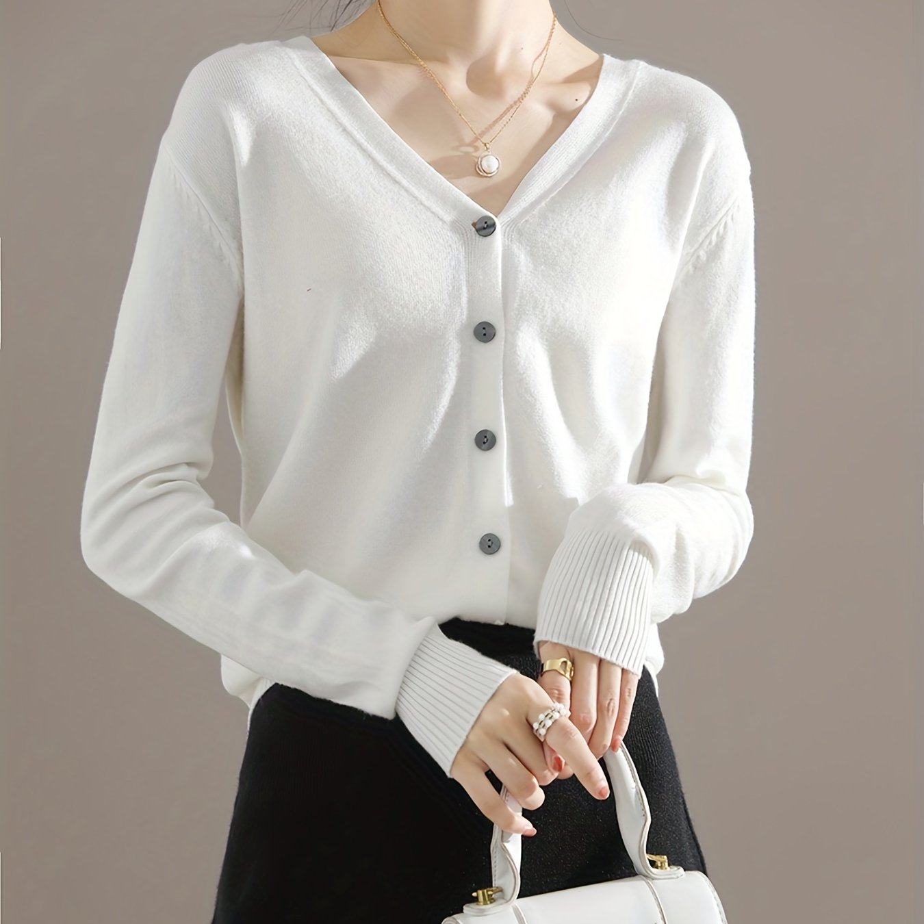 Chic V-neck cardigan with long sleeves, perfect for spring and fall.