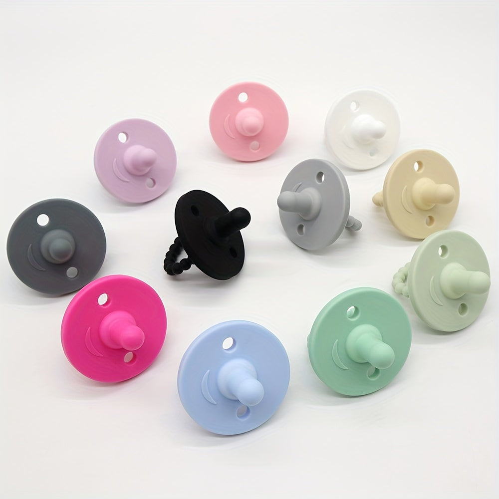 Soft silicone pacifier for newborns with cute round shape, designed to soothe and teethe. Suitable for both boys and girls.