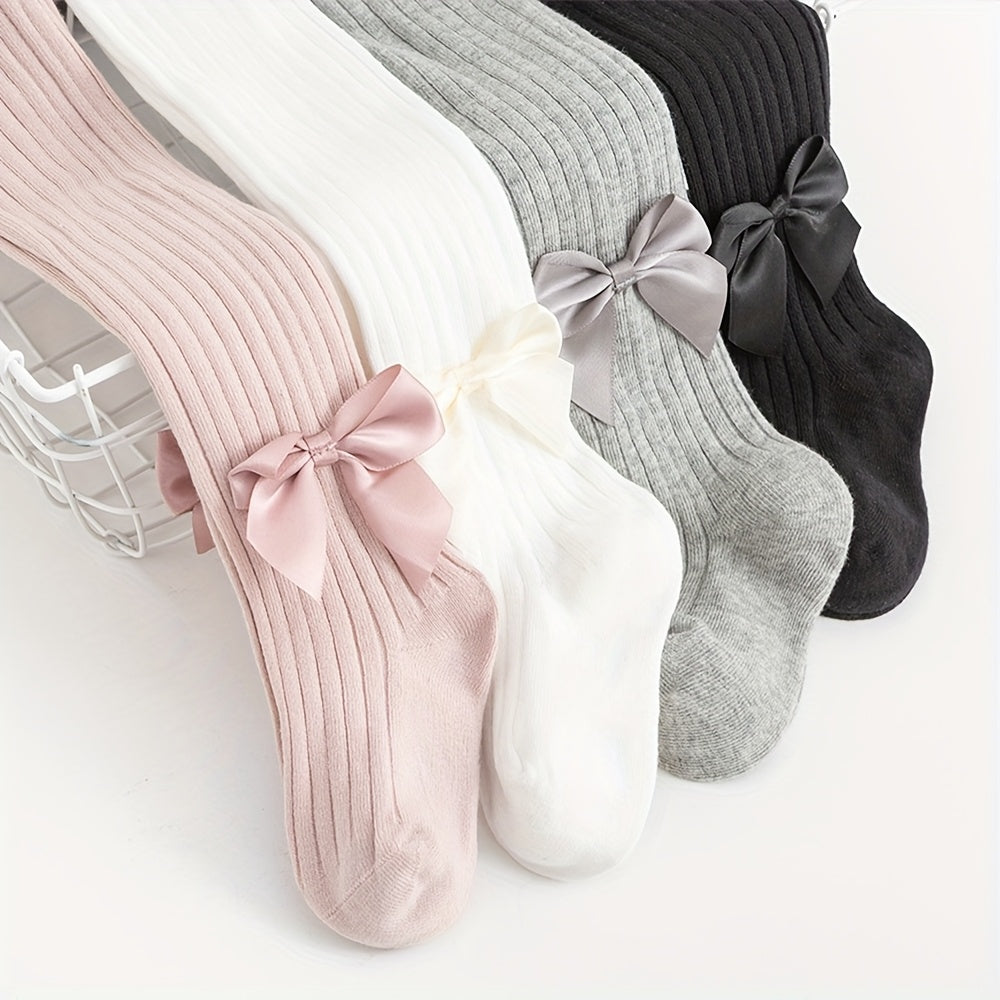 Adorable bow-knot girls' leggings socks in soft ribbed knit, perfect for dance and casual attire. Available in various colors.