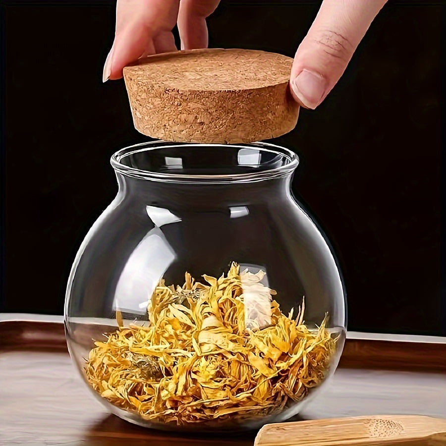 This glass storage jar with cork lid holds 16.9oz and is perfect for storing various items in your kitchen. Made of BPA-free and heat-resistant materials, it is a versatile canister that can be used for storing coffee beans, tea, flour, sugar, and more.