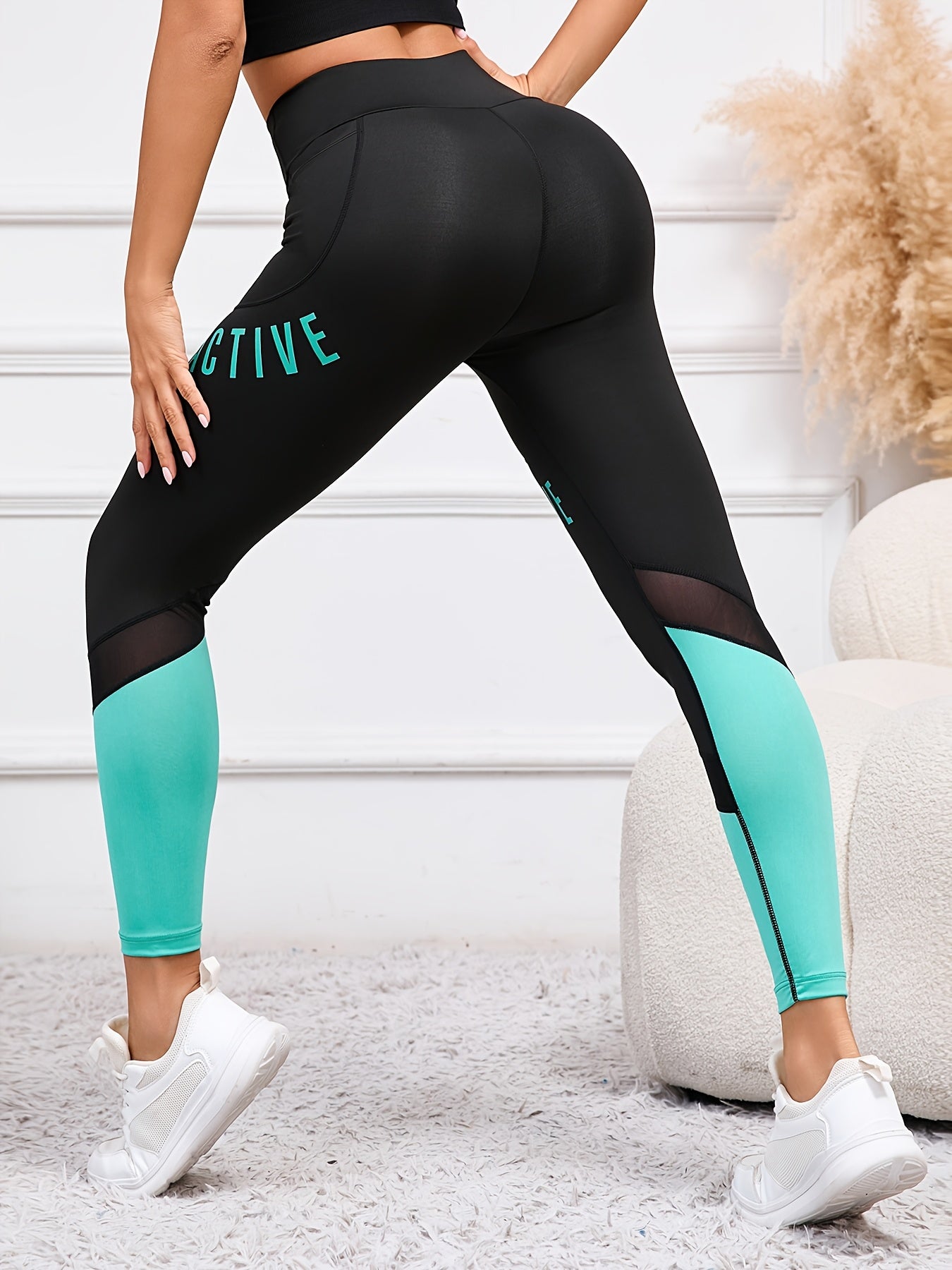 High waisted yoga leggings with pockets and color-block letter print for women's casual sports wear.